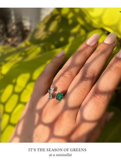 It's the season of greens. This minimalist emerald and diamond ring is a trendy and chic way to add a pop of color to your look.