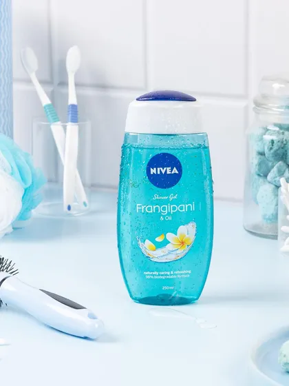 A bathroom shelf scene styled for Nivea's Frangipani shower gel. I used a monochromatic blue color palette and bathroom props to create a realistic, in-context visual that feels both clean and refreshing.