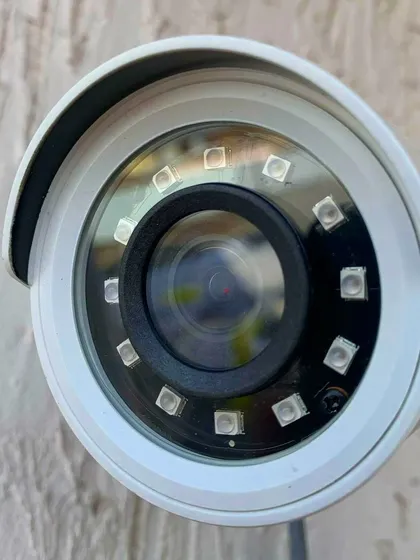 A close-up of a bullet camera's lens and infrared LEDs. These LEDs are essential for clear night vision, and we ensure they are functioning correctly during installation and repair.