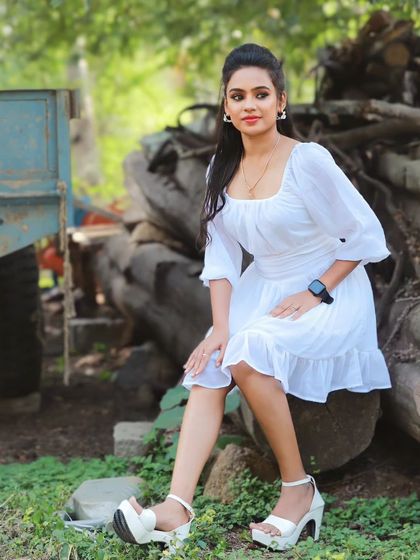 A classic portrait from the outdoor shoot. The makeup is minimal with a soft lip color and defined eyes.