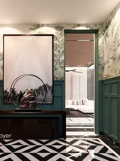 This foyer design for a grand villa uses bold bottle green wainscoting and a geometric marble floor to create an opulent and welcoming entrance.
