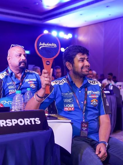 A team representative holds up a paddle during the ISRL Auction. We managed the entire auction process, from the custom software to the production and show run.