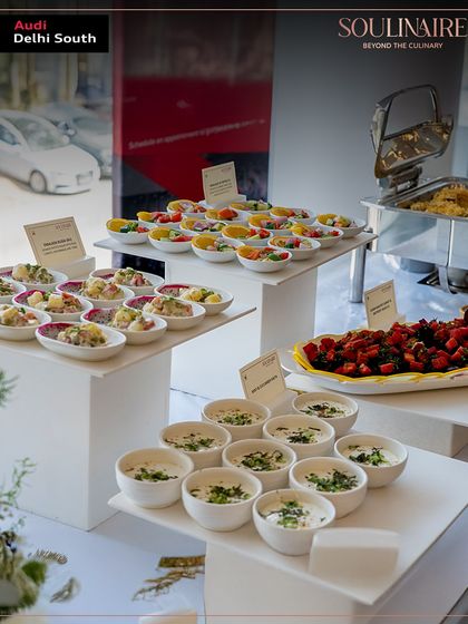 A modern and clean buffet setup at the Audi art exhibition, featuring a variety of fresh salads and cold appetizers. Our presentation is always crisp and contemporary.