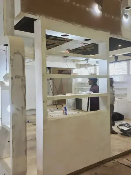 Another angle of booth construction, showing the framework and interior elements being put together.