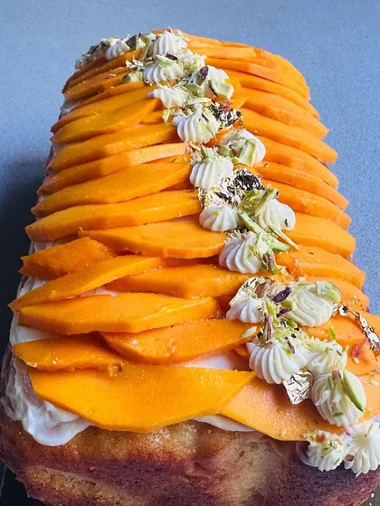 When mango season arrives, I make this stunning Mango Tea Cake. It's a buttery, moist cake topped with cream, fresh mango slices, and edible gold leaf for a touch of luxury.