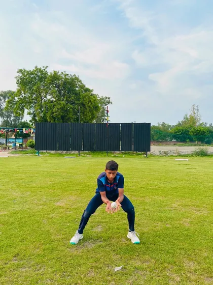 Soft hands. A player completes a catch, showcasing the technique we teach to absorb the ball's impact.