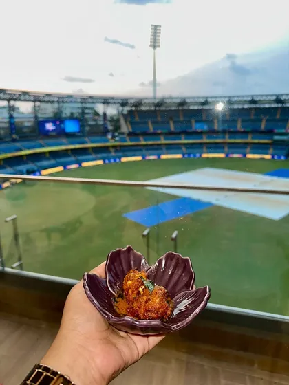 A perfectly plated appetizer with a stunning view of the cricket stadium. We tailor our menus to complement the mood and setting of any event.