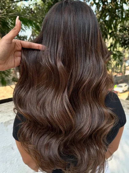 I call this look 'Hazelnut Chocolate Truffle'. It's a deep, rich brunette base with fine hazelnut highlights that add a subtle shimmer. This is a great option for anyone wanting to enhance their dark hair without a drastic change.