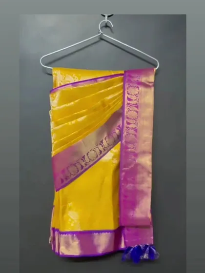 For easy storage and transport, I also offer hanger folding. This beautiful yellow and purple Kanjeevaram is perfectly pleated and hung, ready to be worn with minimal fuss.