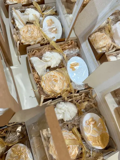 A beautifully curated white and gold candle gift box, perfect for any special occasion.