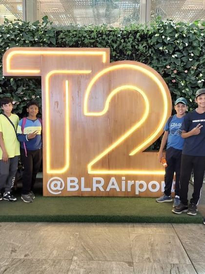 A group of boys from the Aero Sports camp, excited to learn about how an airport operates.