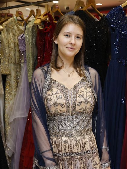 Draped in elegance, shining with grace. This stunning customer is radiating pure charm in this intricately designed rental lehenga.