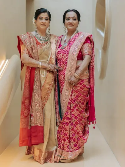 Celebrating heritage and family bonds. I designed these elegant sarees for a mother and daughter, featuring a timeless beige and gold Banarasi weave and a vibrant pink Bandhani saree with custom zardosi and resham work.
