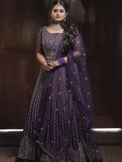 For a different wedding event, we chose this elegant purple lehenga. This demonstrates how I style for the entire wedding celebration, creating distinct yet cohesive looks for functions like the Sangeet or Reception.