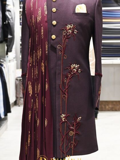 A full-length shot of the wine-colored sherwani, providing a comprehensive look at the outfit.