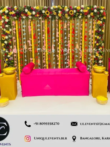 We create vibrant and joyful setups for pre-wedding functions. This haldi ceremony decor uses a bright color palette of yellow and magenta, with a backdrop of fresh flowers and traditional hangings to create a festive atmosphere.