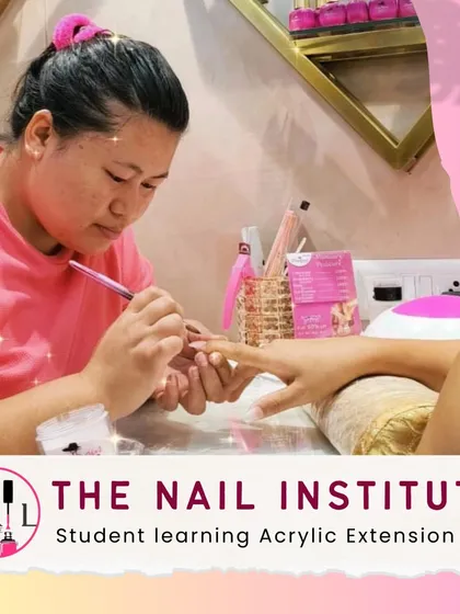 With intense focus, this student is learning the precise techniques for applying acrylic extensions at our Borivali branch.