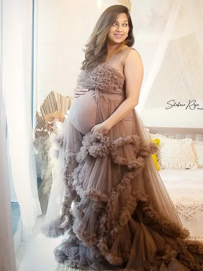 We created such a dreamy and romantic atmosphere for this portrait. Using soft window light and one of my flowing maternity gowns, we captured a truly elegant and timeless image of this beautiful mom-to-be.