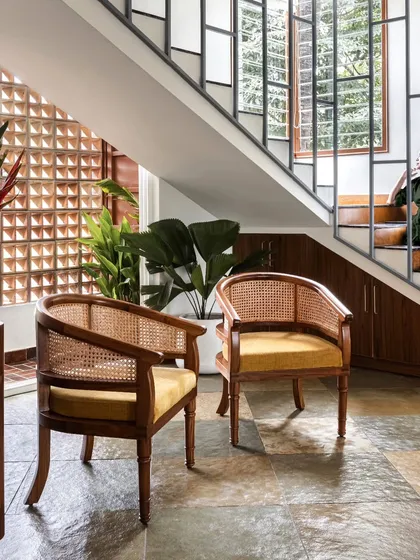 The Ruba armchair showcases our modern Indian design language. Featuring a classic barrel back with natural rattan weaving and a solid teak wood frame, this chair was custom-made for the Dhara residence, proving that timeless elegance and comfort can coexist beautifully.
