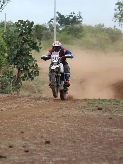 Our coach Pradeep demonstrates his off-road prowess, getting air on a dirt bike during a rally. His experience spans multiple formats, from circuit racing to the rugged stages of rally championships.