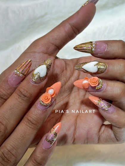 A luxurious set featuring hand-sculpted 3D orange roses, gold chrome details, and pearl accents. This is wearable art.