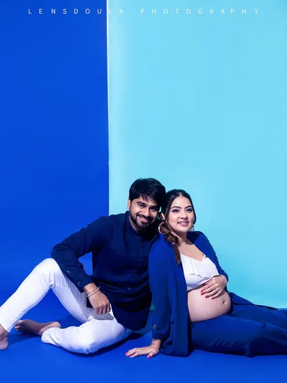 A full-frame couple portrait that feels like a magazine cover. The coordinated blues create a visually stunning and cohesive look.