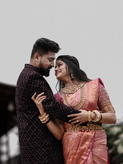 A beautiful, soft-focused portrait of a couple sharing an intimate gaze. The focus is entirely on their connection and emotion.