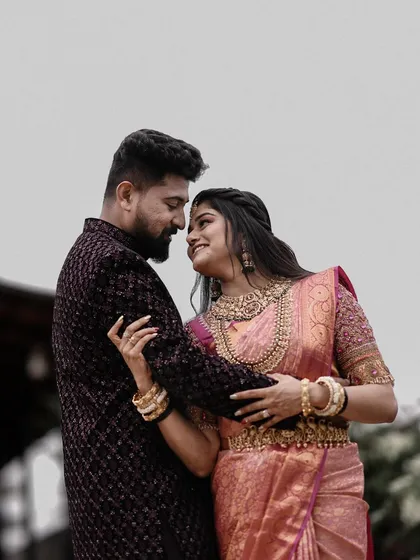 A beautiful, soft-focused portrait of a couple sharing an intimate gaze. The focus is entirely on their connection and emotion.