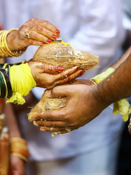 A close-up of the Kanyadaan ritual, where the bride's parents give her away. This symbolic act is one of the most emotional moments of the ceremony.