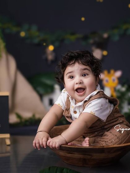 Welcome to the jungle! Our safari-themed shoots are perfect for adventurous little explorers. This nine-month-old is the king of his jungle, surrounded by friendly animal friends and a cute teepee.