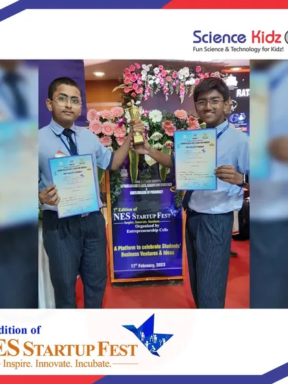 Our two young innovators proudly holding their certificates and trophy after their win at the NES Startup Fest. This success proves that age is no barrier to great ideas.