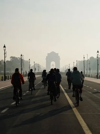 A stunning shot of our group cycling towards India Gate on a misty morning. This is the kind of atmospheric beauty you can only experience on an early ride.