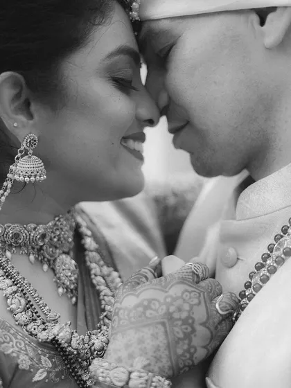The same intimate moment in black and white. Stripping away the color focuses the viewer's attention on the pure emotion and connection between the couple.