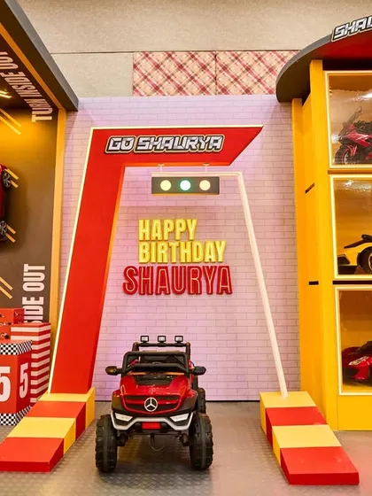 Welcome to Shaurya's Garage. I created this high-energy entrance for a race car theme party, featuring a starting line, traffic lights, and a mini Mercedes, promising a day full of speed and excitement.