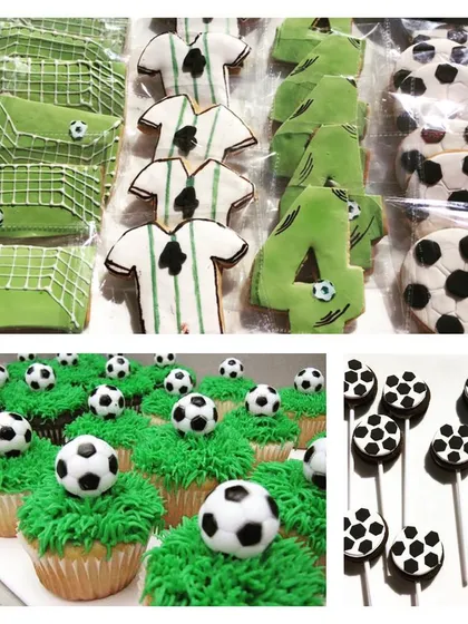 A close-up of the soccer-themed desserts, including goal-shaped cookies, jersey cookies, and cupcakes topped with tiny soccer balls.