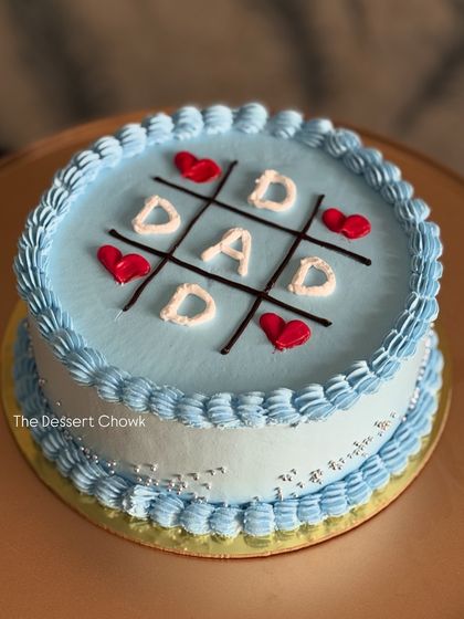 A playful tic-tac-toe cake for a dad's birthday. This was a fresh pineapple cake, customized to bring a smile to his face.