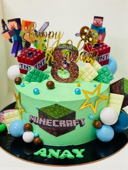 An action-packed Minecraft cake, featuring edible blocks and characters for a gamer's birthday.