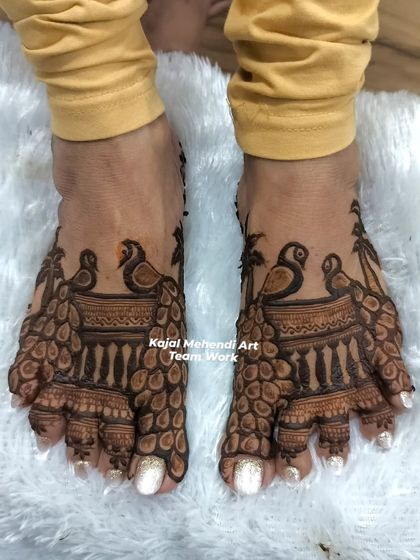 My team did an amazing job on these peacock-themed foot designs for a member of the wedding party. The symmetry and detail are flawless.