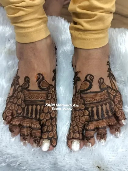 We also do beautiful foot mehndi for the wedding party. This peacock design for the feet complements the hand mehndi perfectly.