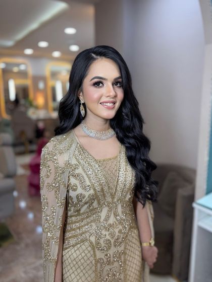 This engagement bride looks absolutely radiant. The makeup enhances her natural beauty without looking heavy.