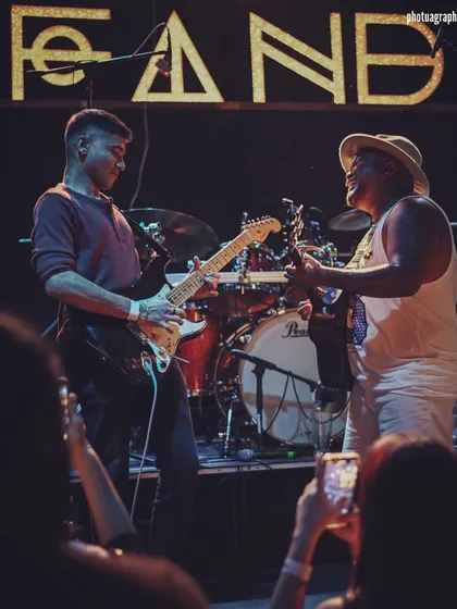 The connection between my bandmates and me is the foundation of our sound. This moment with my guitarist isn't staged; it's the real, unspoken communication that happens when we're lost in the music together.