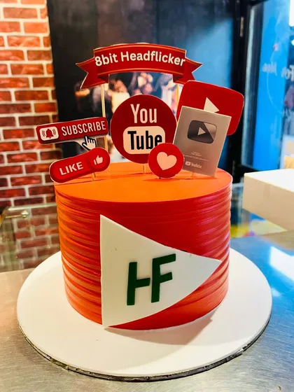 I create cakes for modern businesses too. This vibrant, YouTube-themed cake was designed for a content creator, complete with edible logos, channel branding, and a custom play button award to celebrate their digital achievements.