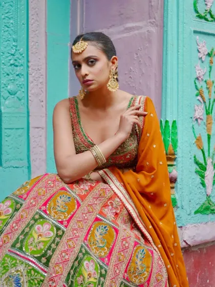 A vision of grace, draped in heritage. This multi-panelled lehenga is a celebration of color and craftsmanship.