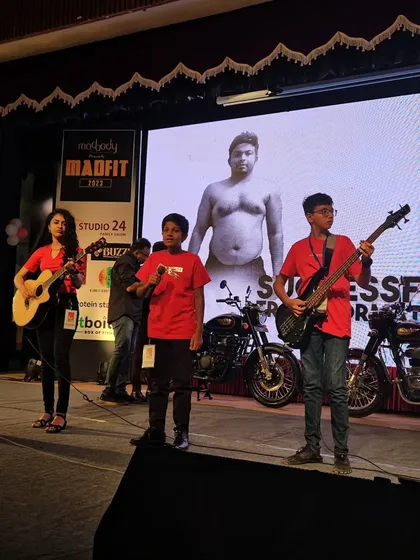 More action from the Madfit 2023 concert, with our students on vocals and bass guitar, performing in front of a large LED screen.
