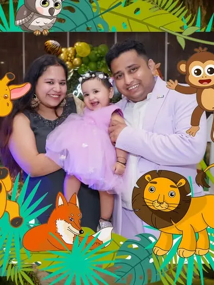 Another creative album design, this one placing the family portrait within a fun, illustrated jungle frame, perfect for a themed birthday.