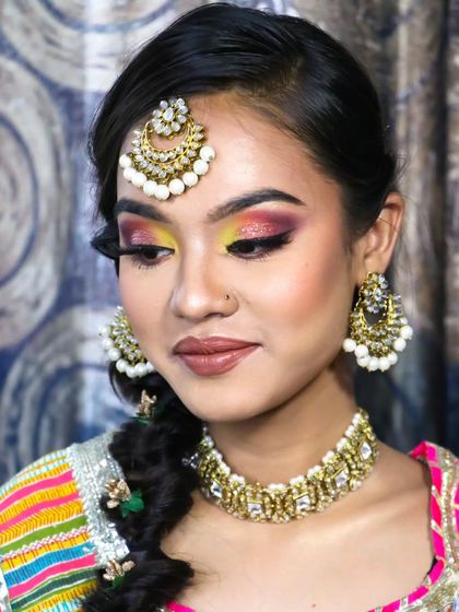 A bold and beautiful eyeshadow masterpiece. This colorful look is designed to make a statement and is perfect for a fun-filled Haldi or Sangeet night.