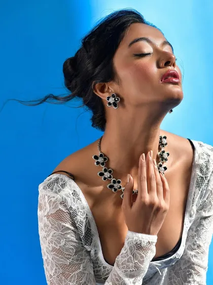 A serene, elegant shot that allows the Curiocottage jewellery to be the main focus. The light catches the details of the pieces beautifully.