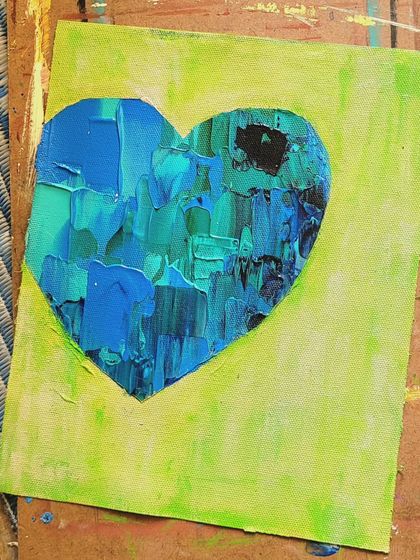 A duplicate shot of the unframed blue and green heart, showing the raw energy of the piece before it's finished and framed.