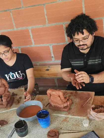 Participants deeply engaged in sculpting their idols. The concentration and peace in the studio during these sessions is truly special.