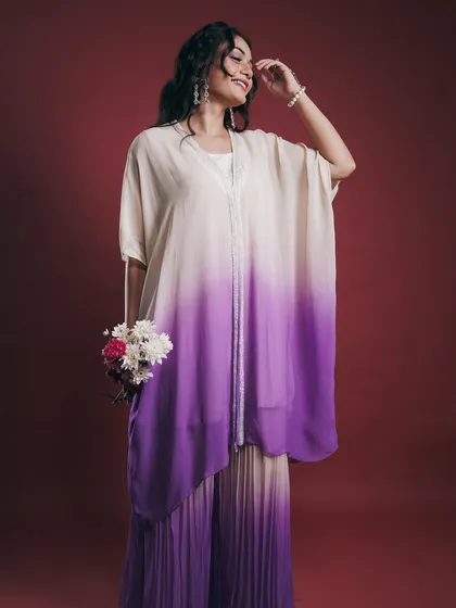 A full-length lookbook shot that shows how the entire outfit moves and feels. The model's natural, happy expression and pose give life to the clothing, showing potential customers how it can be worn.